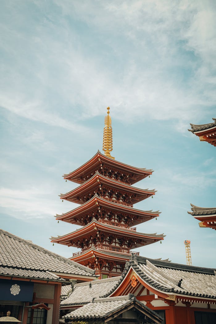 Beautiful Japanese pagoda in Tokyo with clear blue sky, representing traditional architecture.